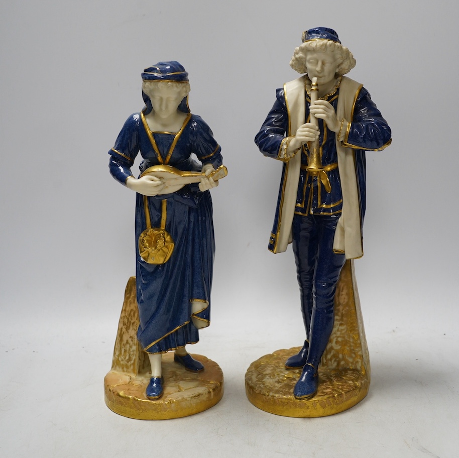 A pair of Worcester 'musician' figures by Hadley, 143 and 126, 30cm. Condition - some wear to gilding